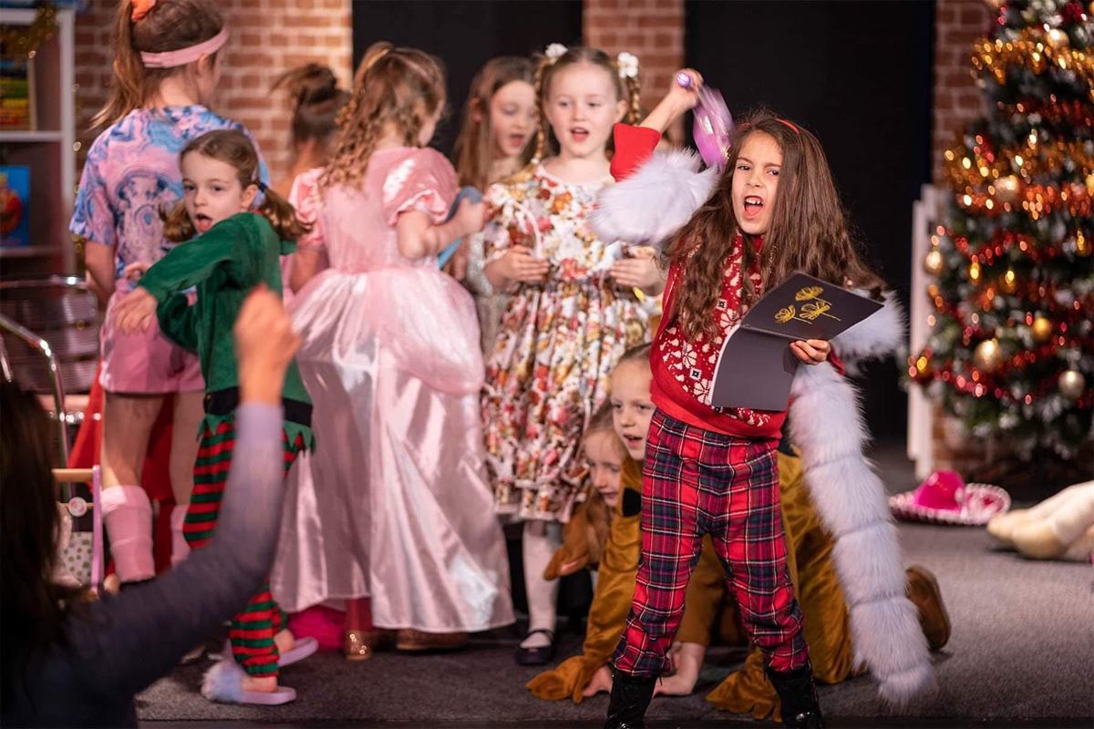 Mini Geeks children performing in costume during their Christmas showcase