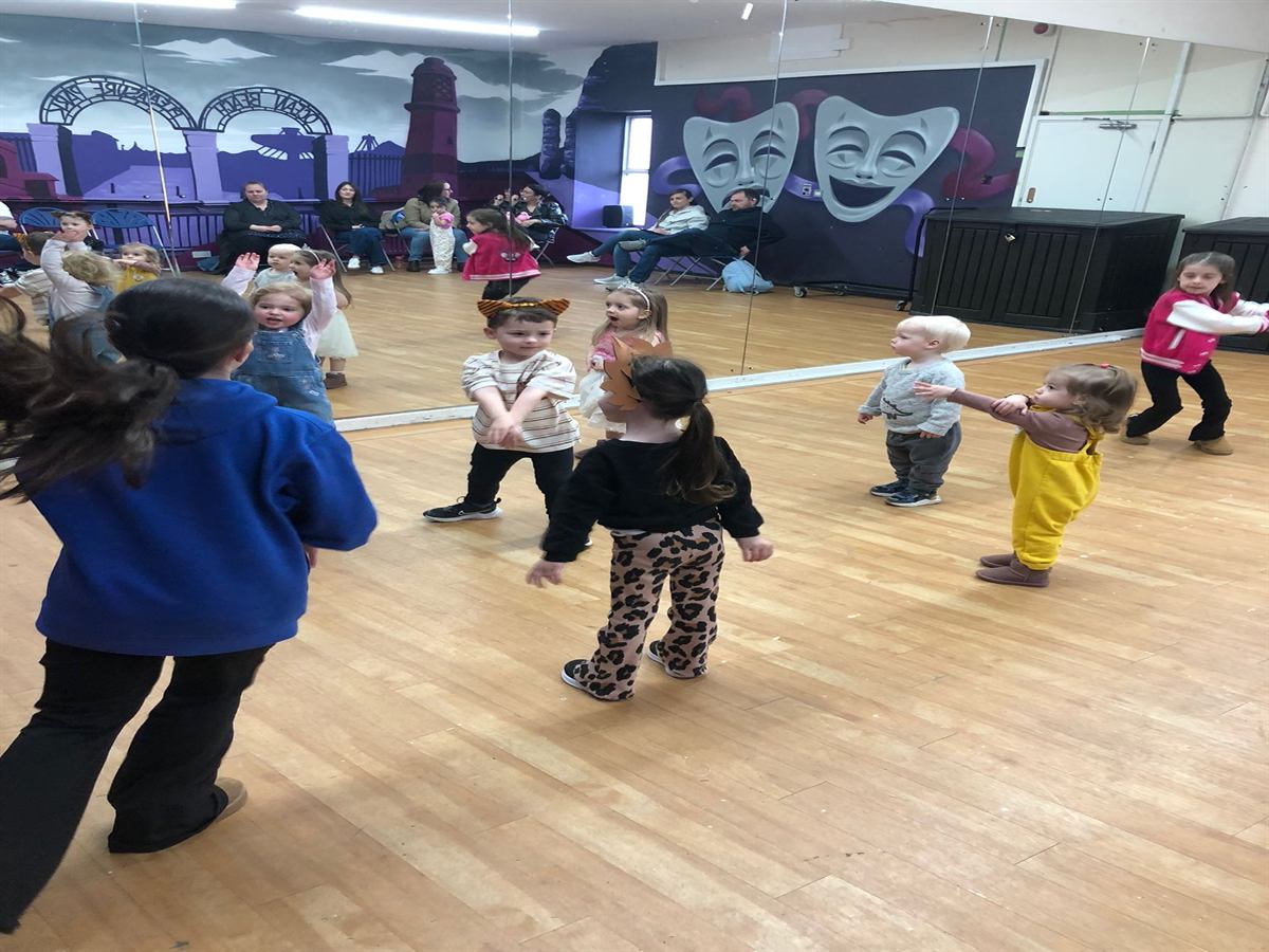 Children taking part in a movement activity during a Mini Geeks class